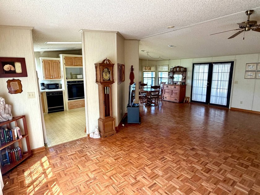 Nestled beneath a canopy of majestic oak trees with serene lake - photo 12