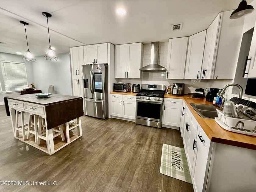 Welcome to Eastlawn! This updated 3-bedroom, 2-bath home sits on - photo 5