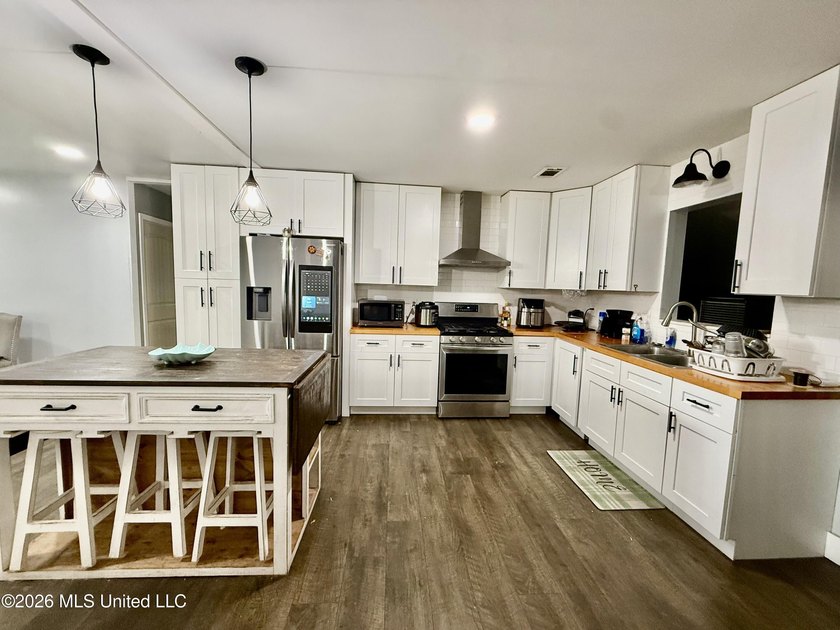 Welcome to Eastlawn! This updated 3-bedroom, 2-bath home sits on - photo 6