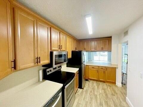 This updated first-floor condo is located in a well-established - photo 7