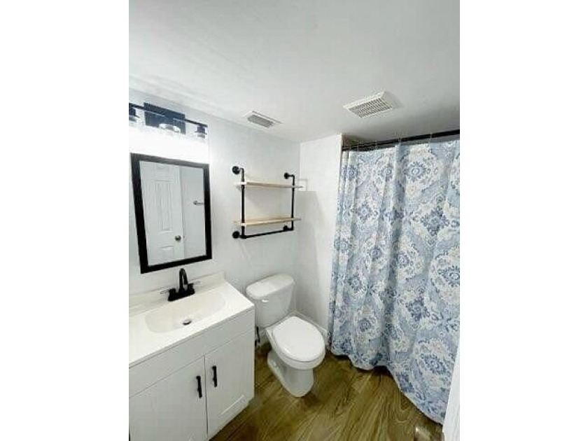 This updated first-floor condo is located in a well-established - photo 9