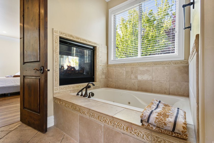 Wake up to sweeping lake and mountain views in this exceptional - photo 17