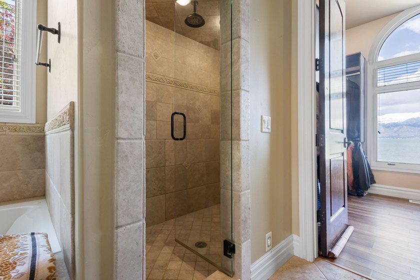 Wake up to sweeping lake and mountain views in this exceptional - photo 18