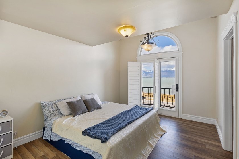 Wake up to sweeping lake and mountain views in this exceptional - photo 26