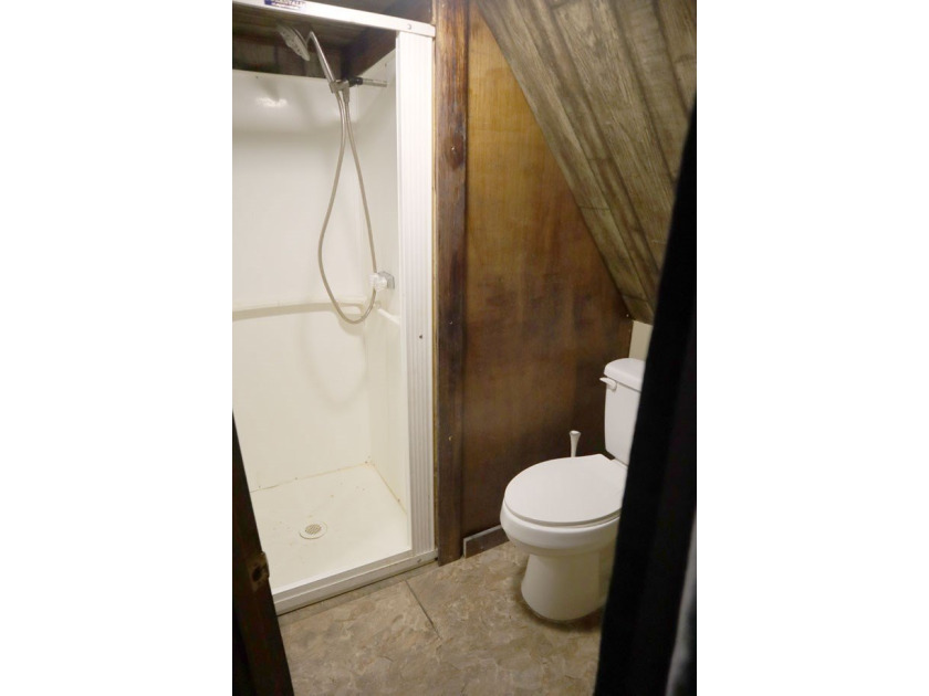 Lots of potential in this cute A-frame home tucked away on a - photo 2