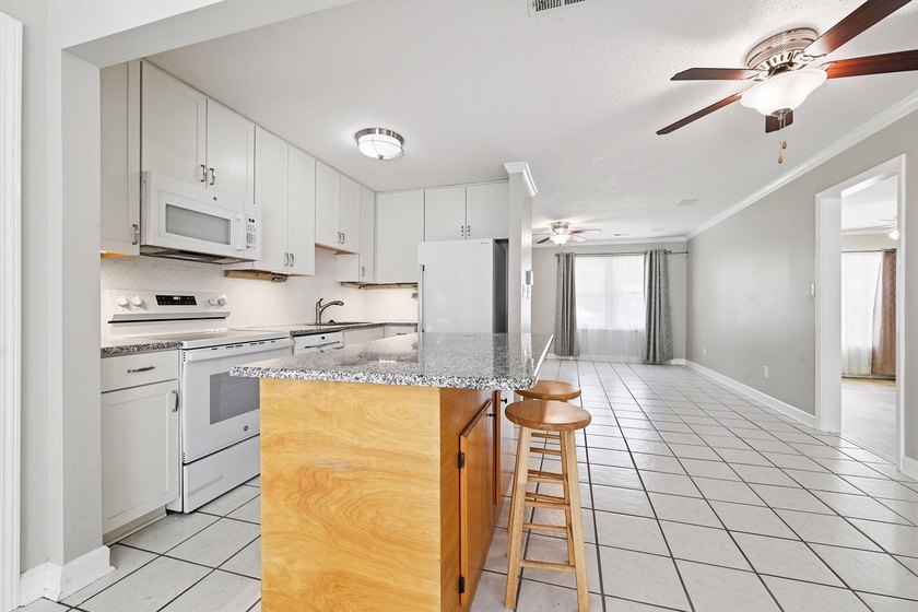 Welcome home to this beautifully updated 3-bedroom, 2-bath brick - photo 12