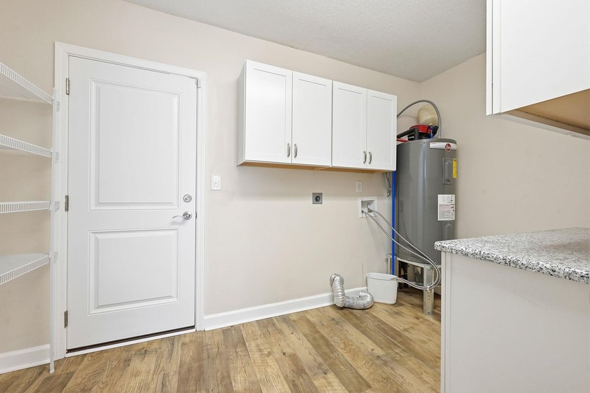 Welcome home to this beautifully updated 3-bedroom, 2-bath brick - photo 17