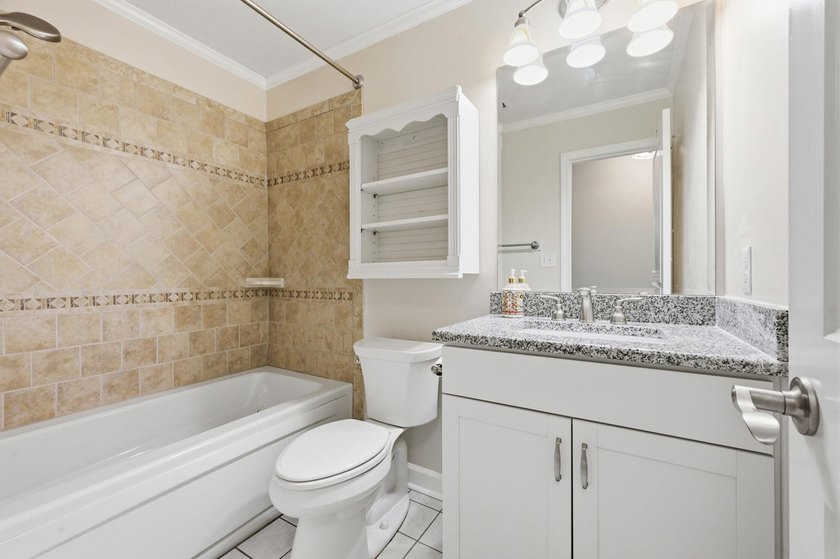 Welcome home to this beautifully updated 3-bedroom, 2-bath brick - photo 22