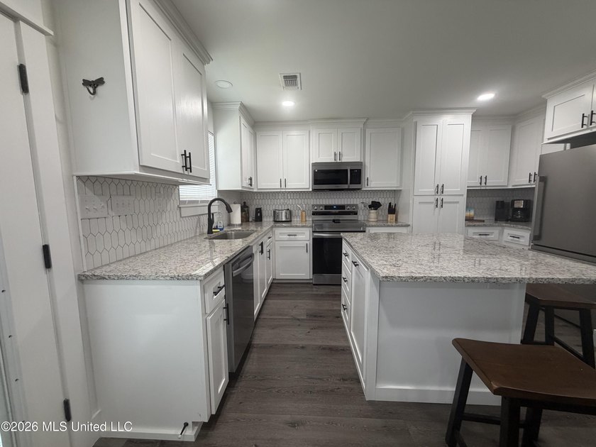 Completely remodeled inside and out, this waterfront coastal - photo 5