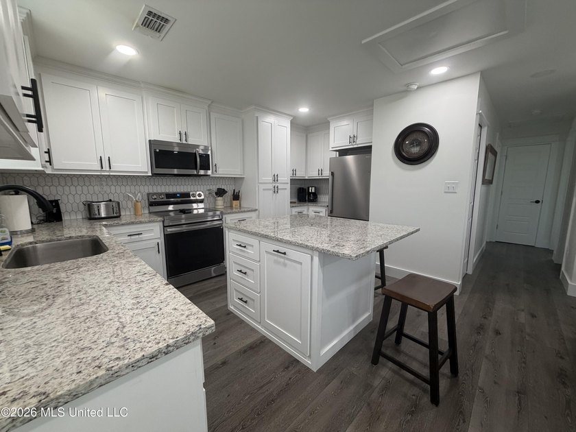 Completely remodeled inside and out, this waterfront coastal - photo 6