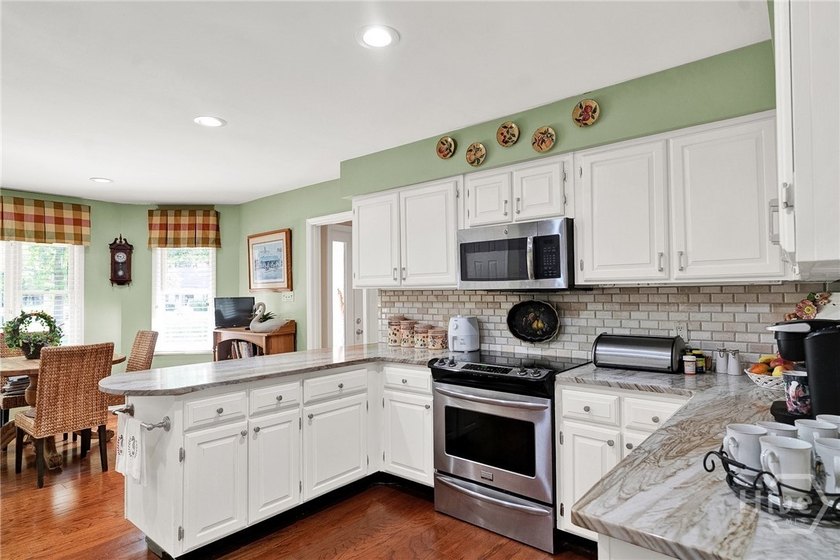 This exceptionally updated, one-level end unit on the lagoon is - photo 7