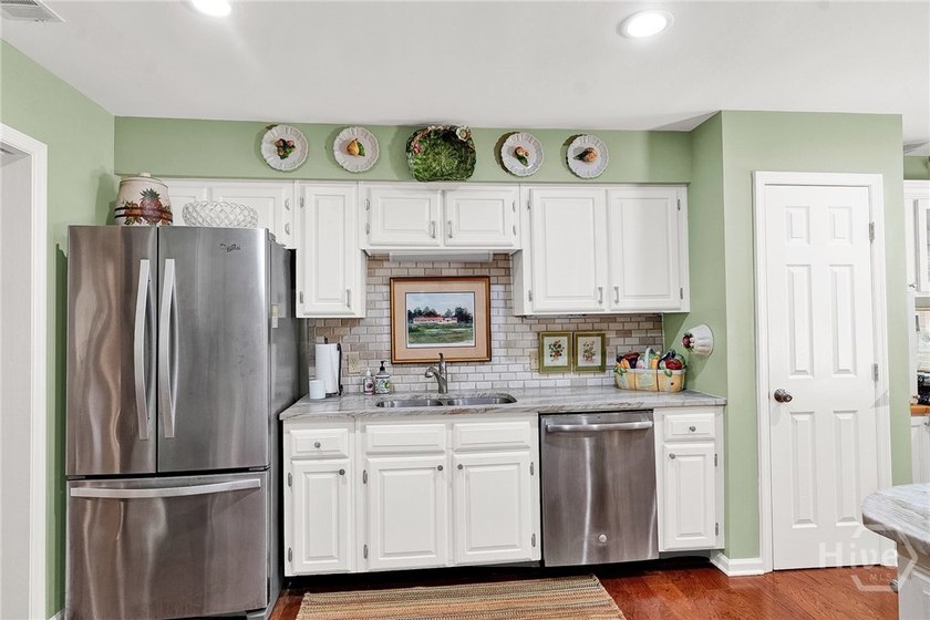 This exceptionally updated, one-level end unit on the lagoon is - photo 8