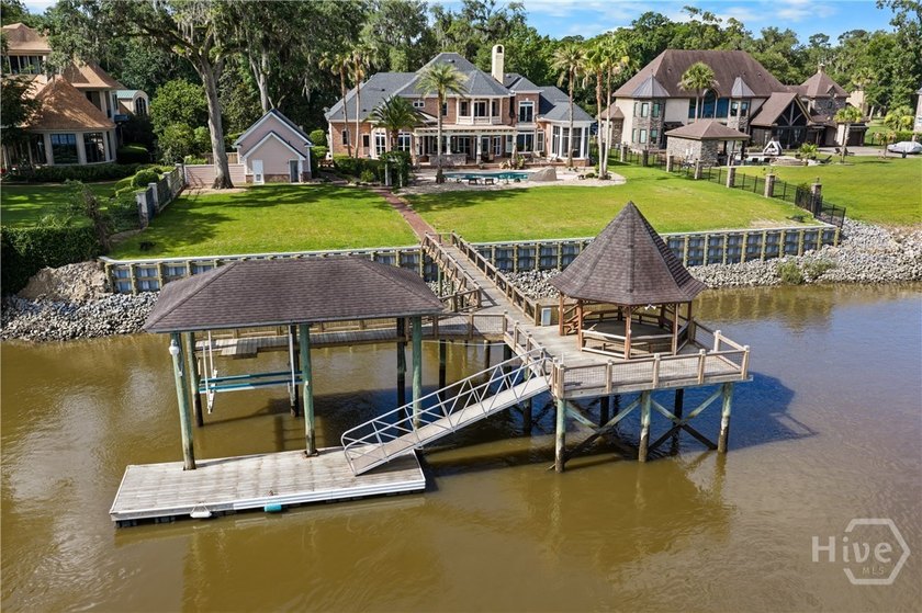 Welcome to an extraordinary riverfront estate where timeless - photo 4