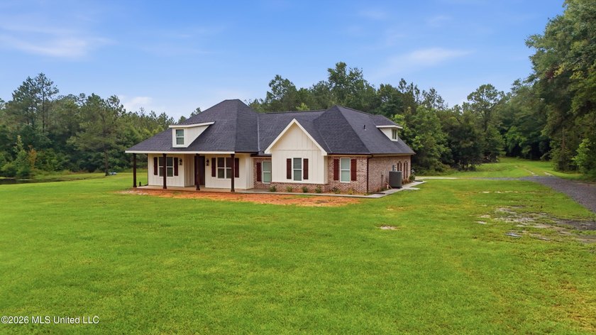 Nearly Brand New on 7.9 Acres! Completed in late 2024, this - photo 2