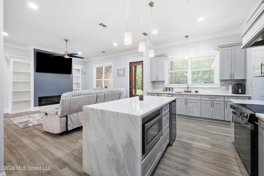 Nearly Brand New on 7.9 Acres! Completed in late 2024, this - photo 9