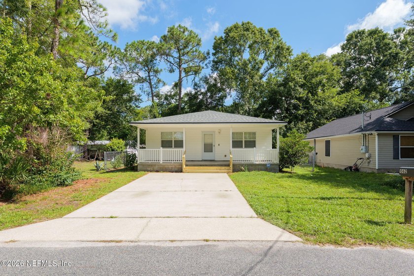 This charming cottage-style home with 3 beds + 2 baths is - photo 2