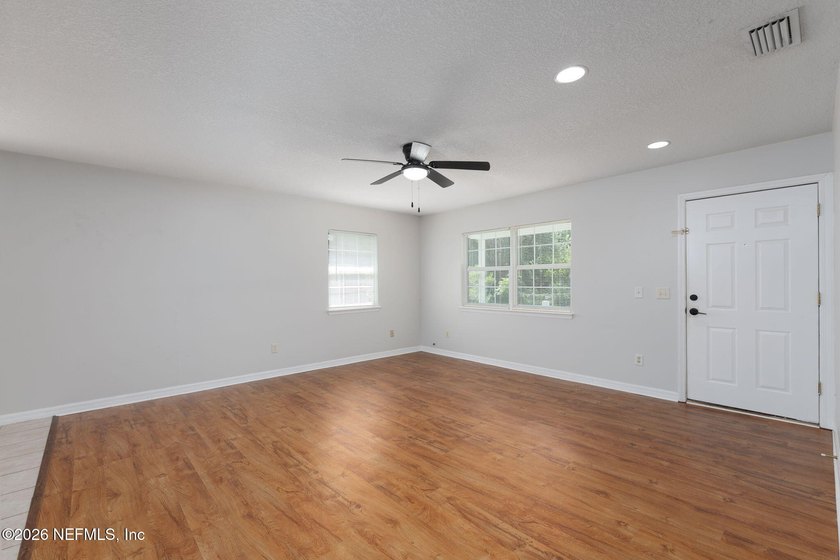 This charming cottage-style home with 3 beds + 2 baths is - photo 5