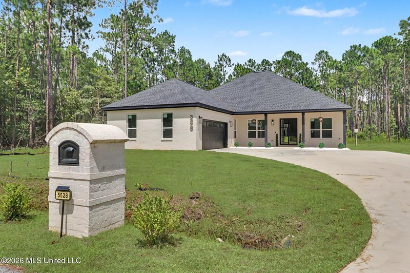 Welcome to this stunning custom-built 2025 home, where modern - photo 3