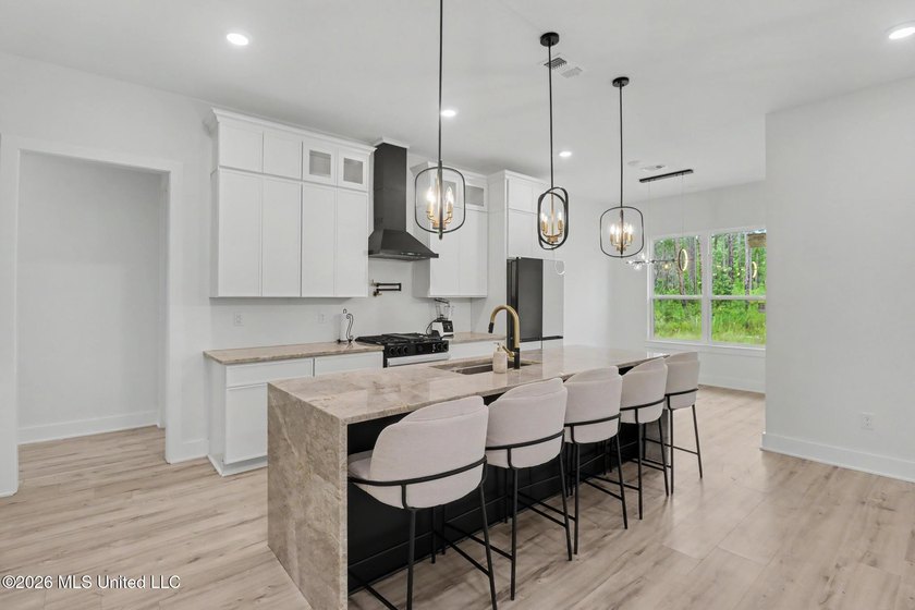 Welcome to this stunning custom-built 2025 home, where modern - photo 8