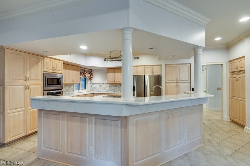 Step into an extraordinary two-story foyer where timeless - photo 14