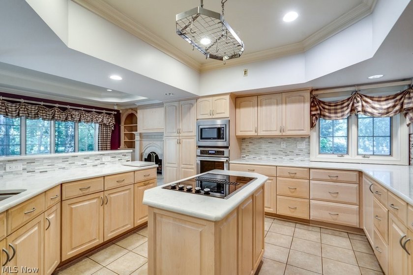 Step into an extraordinary two-story foyer where timeless - photo 16