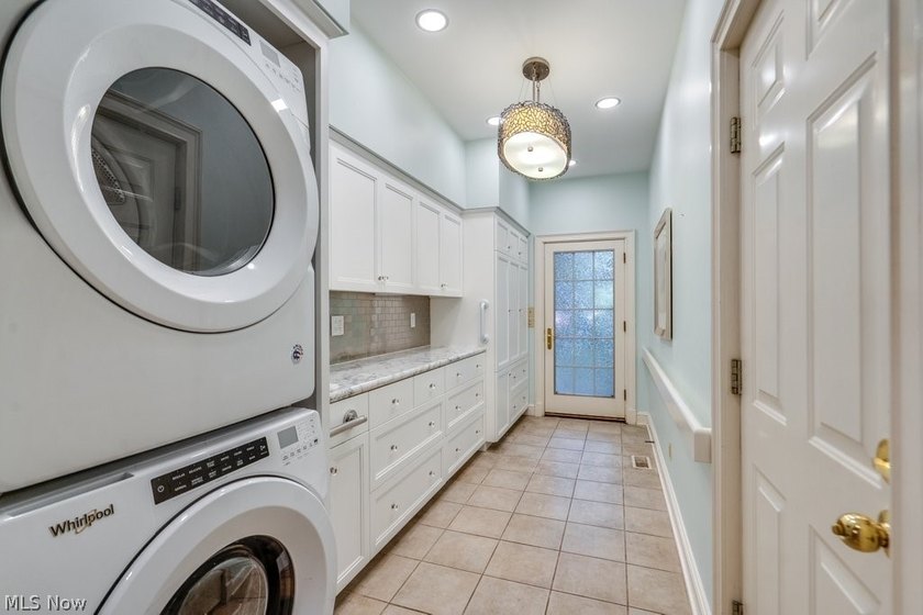 Step into an extraordinary two-story foyer where timeless - photo 18