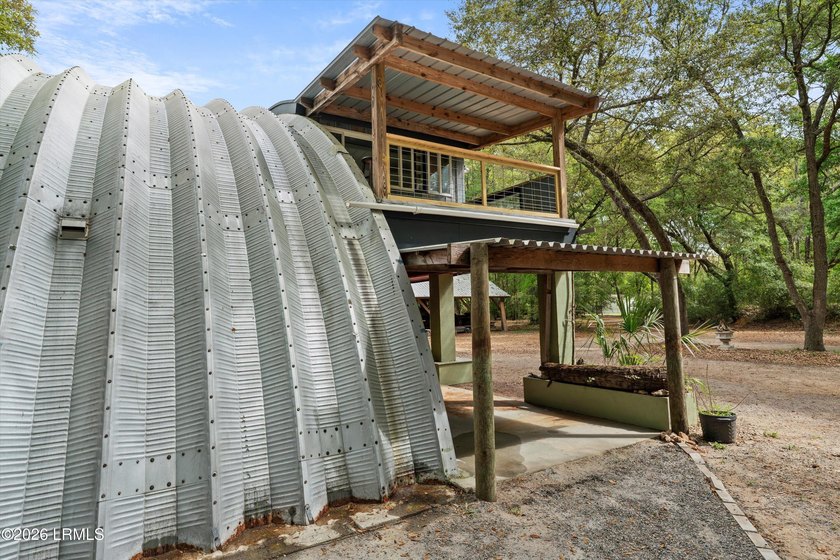 Tucked away down a quiet dirt road on 4.83 private acres on - photo 11