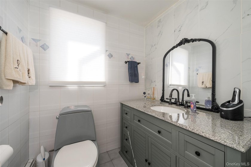 Deceptive from the outside, this expanded Colonial home offers - photo 11
