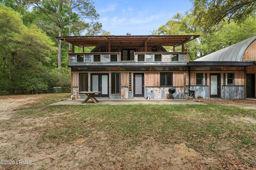 Tucked away down a quiet dirt road on 4.83 private acres on - photo 17