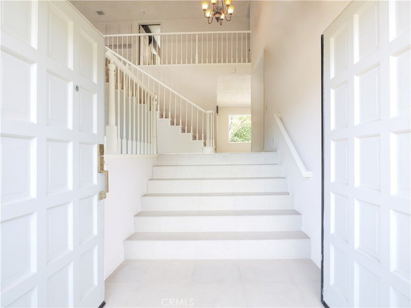 Situated on a quiet street overlooking a lush greenbelt in the - photo 3