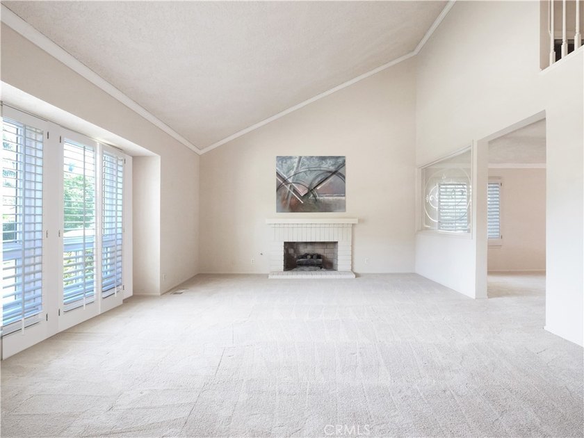 Situated on a quiet street overlooking a lush greenbelt in the - photo 4
