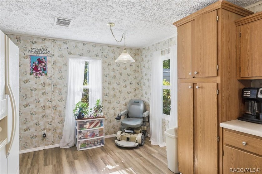 Framed by a canopy of mature trees and lush landscaping, this - photo 15