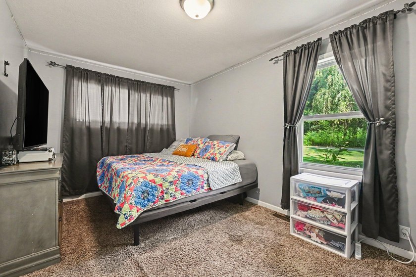 Nestled on 2 beautiful acres, this spacious ranch offers the - photo 11