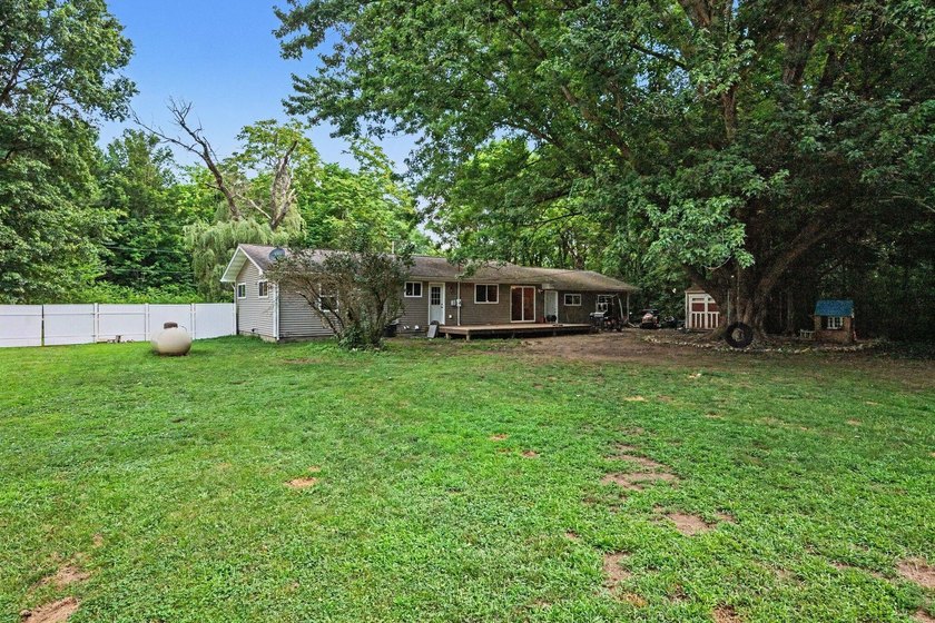 Nestled on 2 beautiful acres, this spacious ranch offers the - photo 20