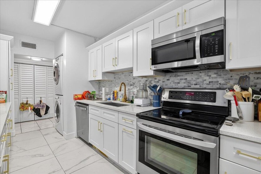 This spacious 2/2 ground-floor condo offers the perfect blend of - photo 12