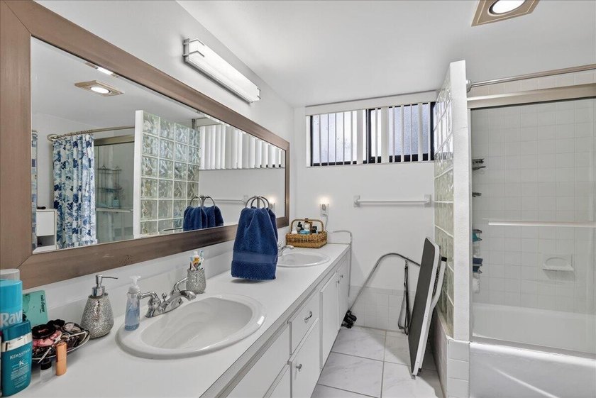 This spacious 2/2 ground-floor condo offers the perfect blend of - photo 18