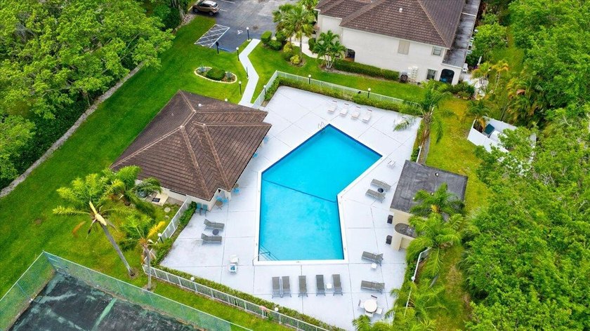 This spacious 2/2 ground-floor condo offers the perfect blend of - photo 24