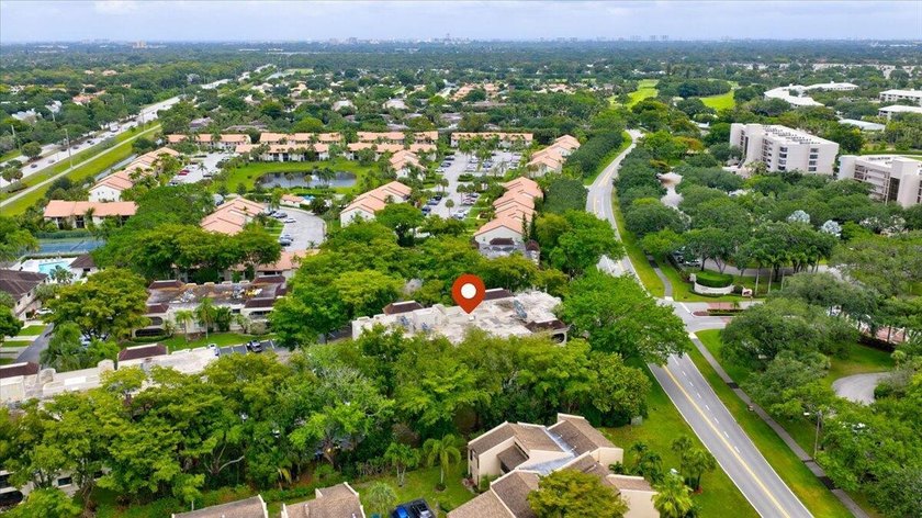 This spacious 2/2 ground-floor condo offers the perfect blend of - photo 25