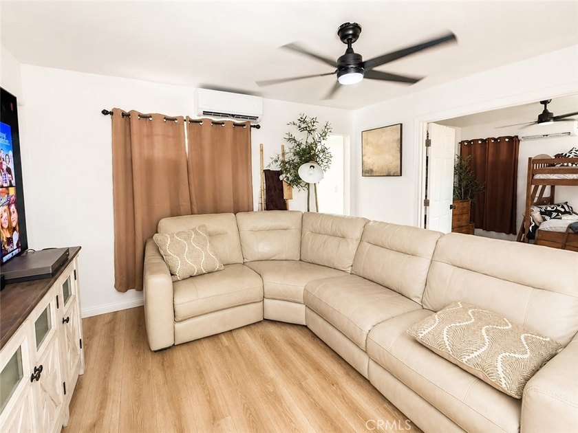 Welcome to this charming and fully upgraded single-family home - photo 2