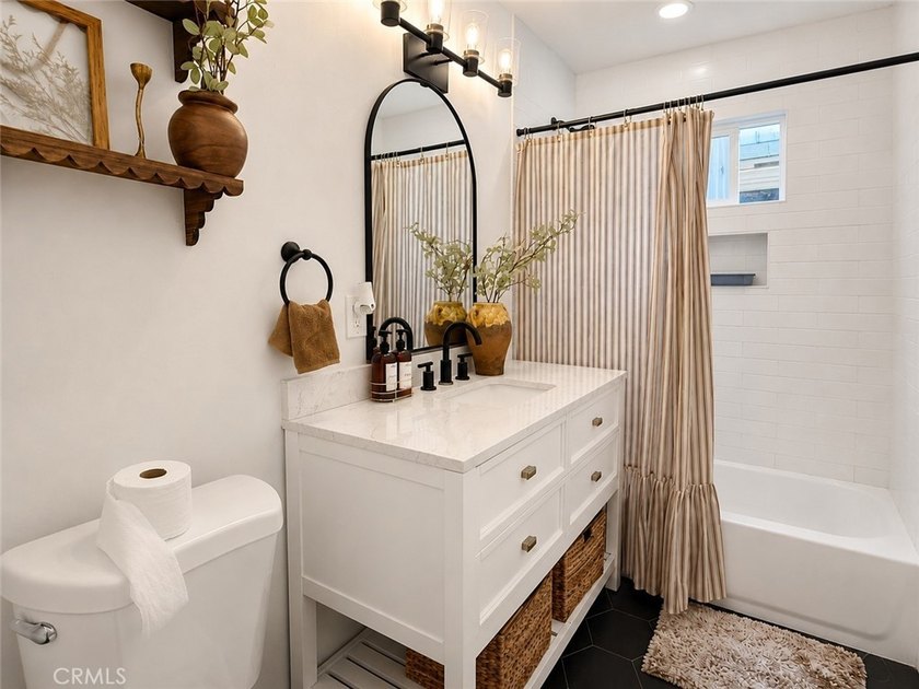 Welcome to this charming and fully upgraded single-family home - photo 5