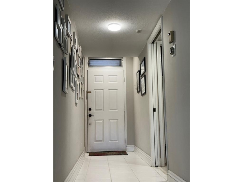 Discover this delightful first-floor unit in the sought-after - photo 6