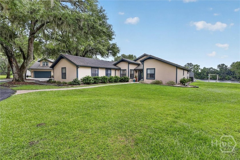 Nestled beneath 22 mature oak trees and surrounded by coastal - photo 3