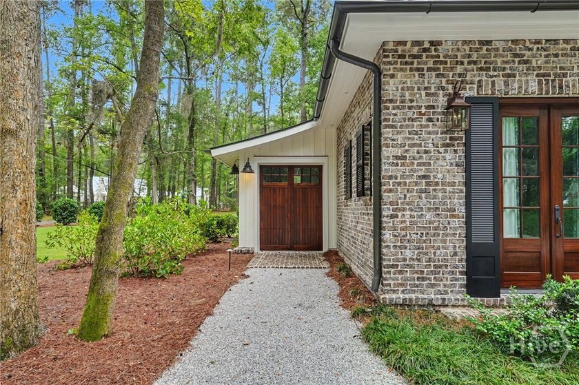Tucked beneath a canopy of majestic live oaks draped in Spanish - photo 4
