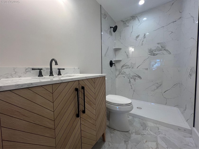 Brand-new custom Cape Cod home offering East End living with a - photo 9