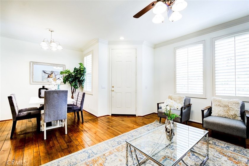 RARE DUAL PRIMARY LAYOUT! Welcome to effortless luxury living in - photo 3
