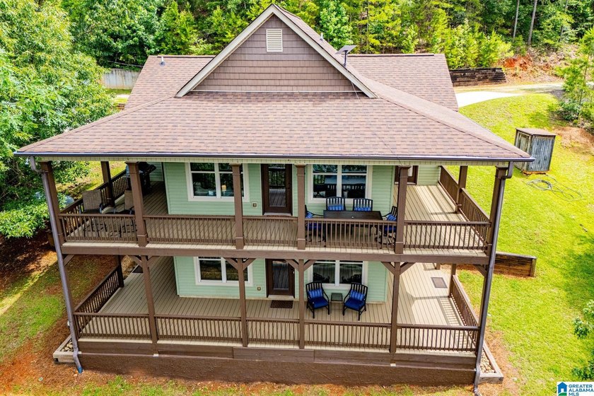 THIS LAKE FRONT HOME WITH AN OPEN FLOOR PLAN OFFERS COMFORT AND - photo 6