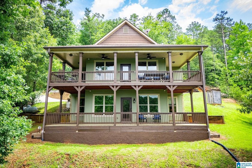 THIS LAKE FRONT HOME WITH AN OPEN FLOOR PLAN OFFERS COMFORT AND - photo 7