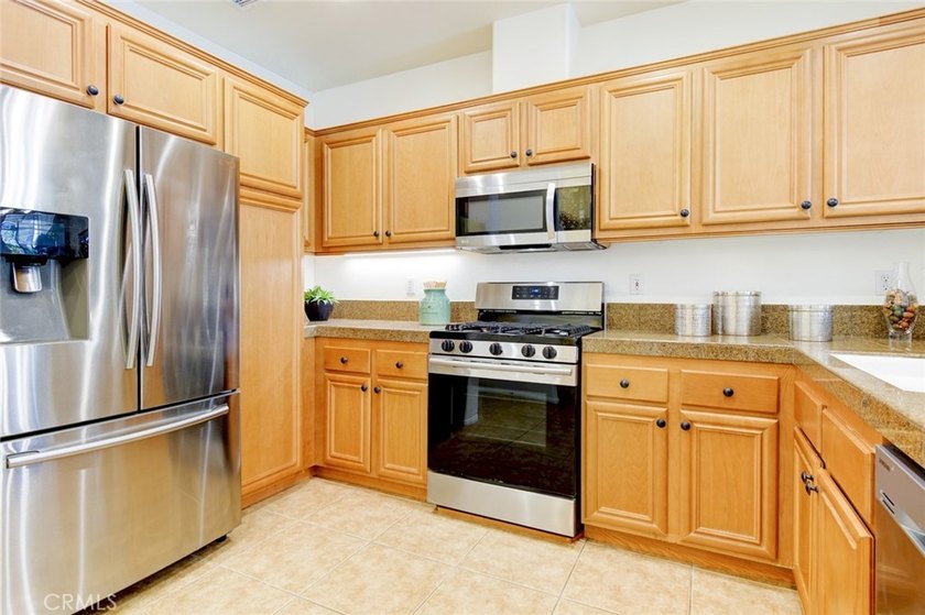 RARE DUAL PRIMARY LAYOUT! Welcome to effortless luxury living in - photo 9