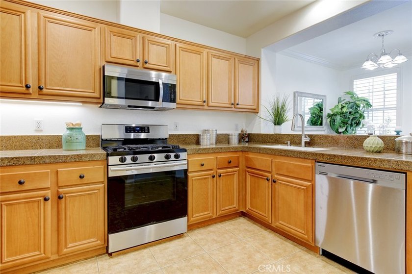 RARE DUAL PRIMARY LAYOUT! Welcome to effortless luxury living in - photo 10