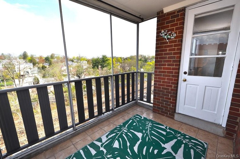 Perched on the top-floor corner, this sun-drenched 2-bedroom - photo 12